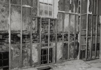 Interior.
Detail of first floor S wall showing earlier windows.