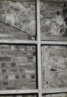 Interior.
Detail of first floor S wall showing blocked opening.
