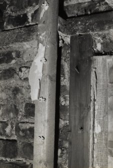 Interior.
Detail of first floor S wall showing sawn timber framing.