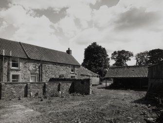 View from NW across courtyard, showing rear of Stable House (former Coach House).