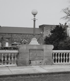 Detail of lamp standard and commemorative plaque.