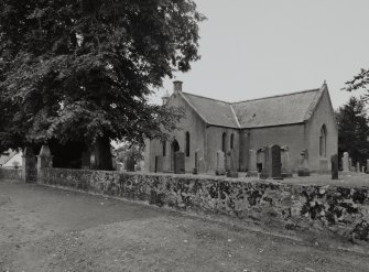 View of church, graveyard and surrounding wall from road.