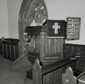 Interior
Detail of pulpit with older baptismal bowl projecting from it.
