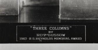 Detail of title plate on plinth of sculpture 'Three Columns' by Roy Gussow. Awarded to Cumbernauld New Town in 1967 for Community Architecture by a jury selected by The American Institute of Architects.