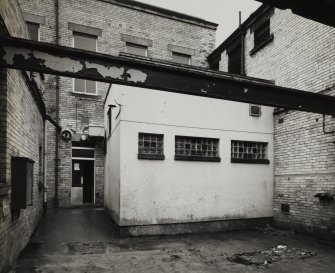 Glasgow, 84-86 Craigie Street, Craigie Street Police Station, interior.
General view of courtyard detention cells from W-N-W.