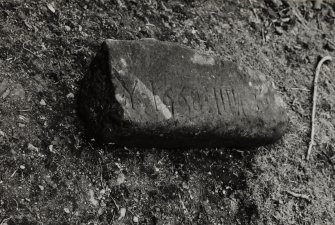 Detail of remains of incised stone.