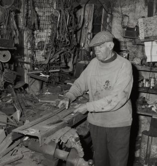 Smiddy, Emil Kozoki, blacksmith, at work