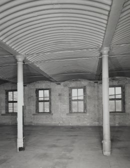 Interior. 4th floor, detailed view of typical bay after the removal of the wooden cubicles, showing the structure of concrete vaults contained by corrugated iron, supported on cast-iron columns