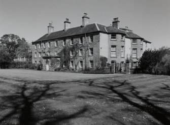 View from SW showing garden and entrance fronts.