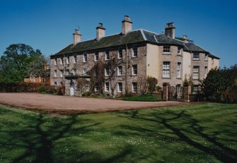 View from SW showing garden and entrance fronts.