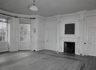 Interior. 
First floor original dining room, view from North showing Edwardian fireplace flanked by Ionic pilasters.