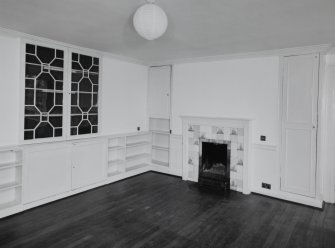 Interior. 
First floor ladies drawing room, view from North West showing the firplace and fitted china cabinet.