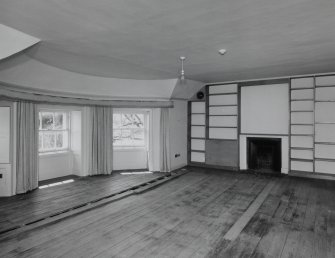 Interior. 
Second floor South central bedroom, view from North East showing fireplace and bow window.