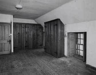 Interior. 
North wing first floor coachmans room, view from North showing window and fitted cupboards.