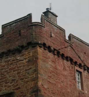 Detail of tower showing corbel course and gable raggle