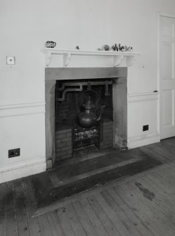 Interior. First floor drawing room detail of fireplace