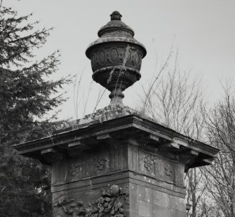 Detail of lidded urn on top of gate pier