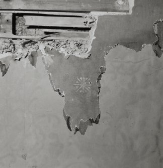 Ground floor, South East room, wall, remnants of original star stencil decoration