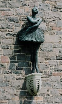 Detail of sculpture of ballerina on 1959 block
