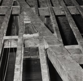 Interior.
Detail of floor timbers showing diagonal bracing.