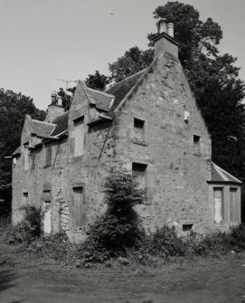 View from SW showing blocked opening in the W gable of the 17th century house and 19th century addition.