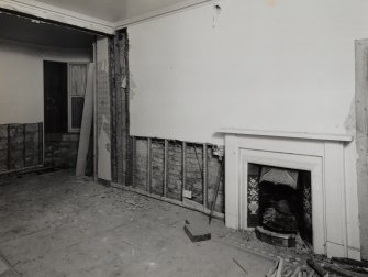 Interior.
View from W of ground floor SW room showing blocked opening.