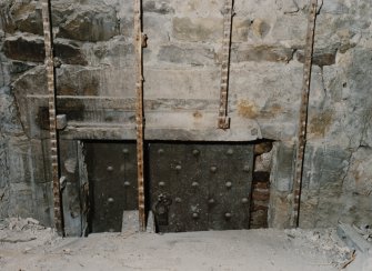 Interior.
Detail of ground floor central room showing wooden door and wrought iron hinge.