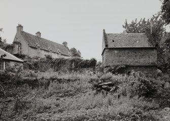 Doocot and Malleny house, view from W