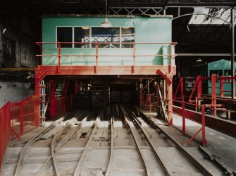 Newtongrange, Lady Victoria Colliery, Pithead Building (Tub Circuit, Tippler Section, Picking Tables)
Pithead upper decking level, Tub Circuit: view from west of shaft, showing track, tubs and gantry above shaft with control cabin