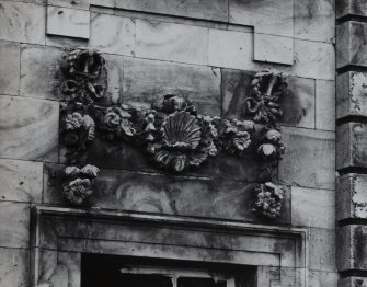 Detail of carved decoration above window, E elevation.