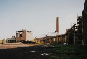 Newtongrange, Lady Victoria Colliery, Fines Treatment Plant and Thickener
General view from W of north end of colliery, showing (left to right) the Fines Treatment Plant, Woodroad Stores, Boilerhouse Chimney, and (extreme right) the N end of the Tub Circuit building