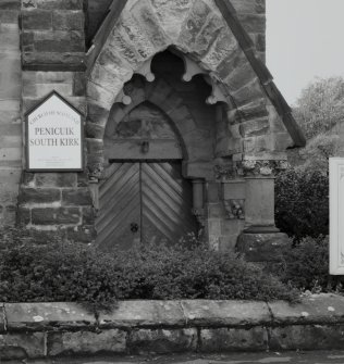 Detail of cusped arched entrance.