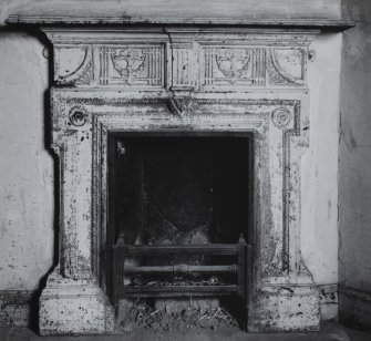 Interior.
View of cast iron fireplace in basement E corridor.