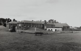 Hospital buildings.
General view from SW showing the ward blocks, chapel and original house.