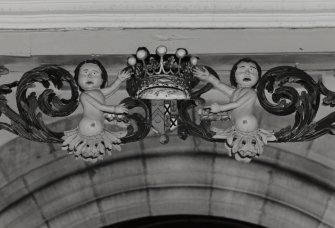 Interior.
Detail of carved coat of arms with figures above balcony of Hopetoun Loft.