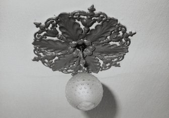 Interior.
Detail showing central plasterwork rose with modern electric light fitting.