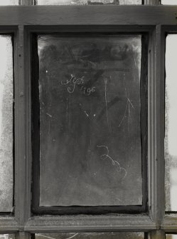 Detail of initials and date (1796) carved in window pane