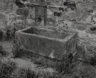Detail of stone trough situated in front of SE side of steading.