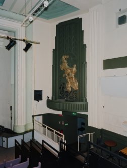 Interior. Main cinema (now theatre), view from W showing panel with charioteer relief