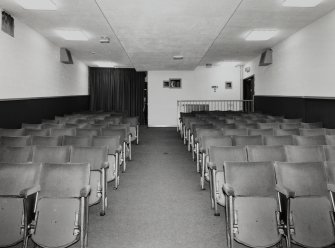 Interior. Small cinema, view from W showing seating