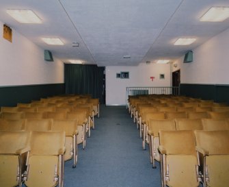 Interior. Small cinema, view from W showing seating