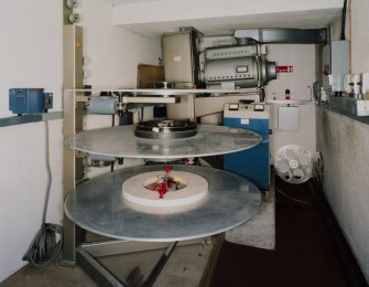 Interior. Projection room, view showing projector and rewinding discs