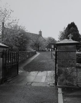 View from NE showing entrance gates and main approach