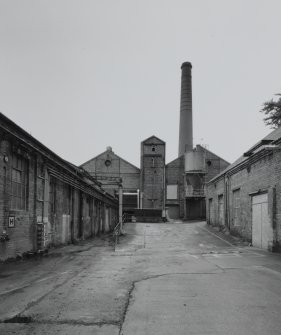 View from SSE showing paper mill (left), 'clay building (right), and boilerhouse and chimney (centre)