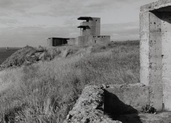 View of twin 6 pounder gun emplacements and observation post from 12 pounder gun emplacement to East