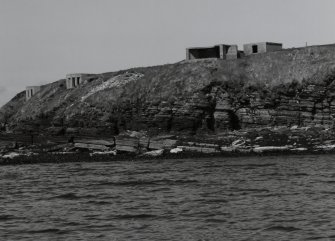 Searchlights and gun emplacement, view from sea to SE