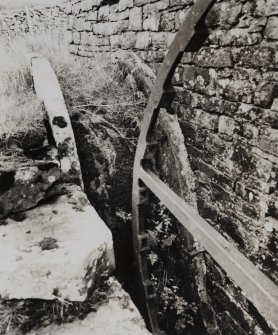 Detail of single-frame back-shot waterwheel on N wall of mill.
