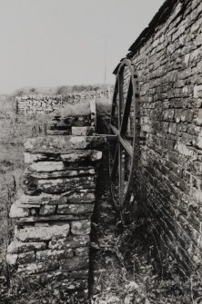 Detail of single-frame back-shot waterwheel on N wall of mill.
