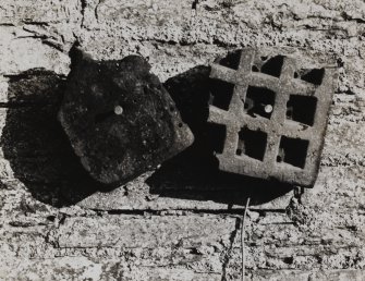 Detail of fragments of terra-cotta kiln-plates from earlier mill.