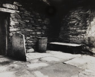Interior.
Kitchen, detail of stone bench in NW angle.